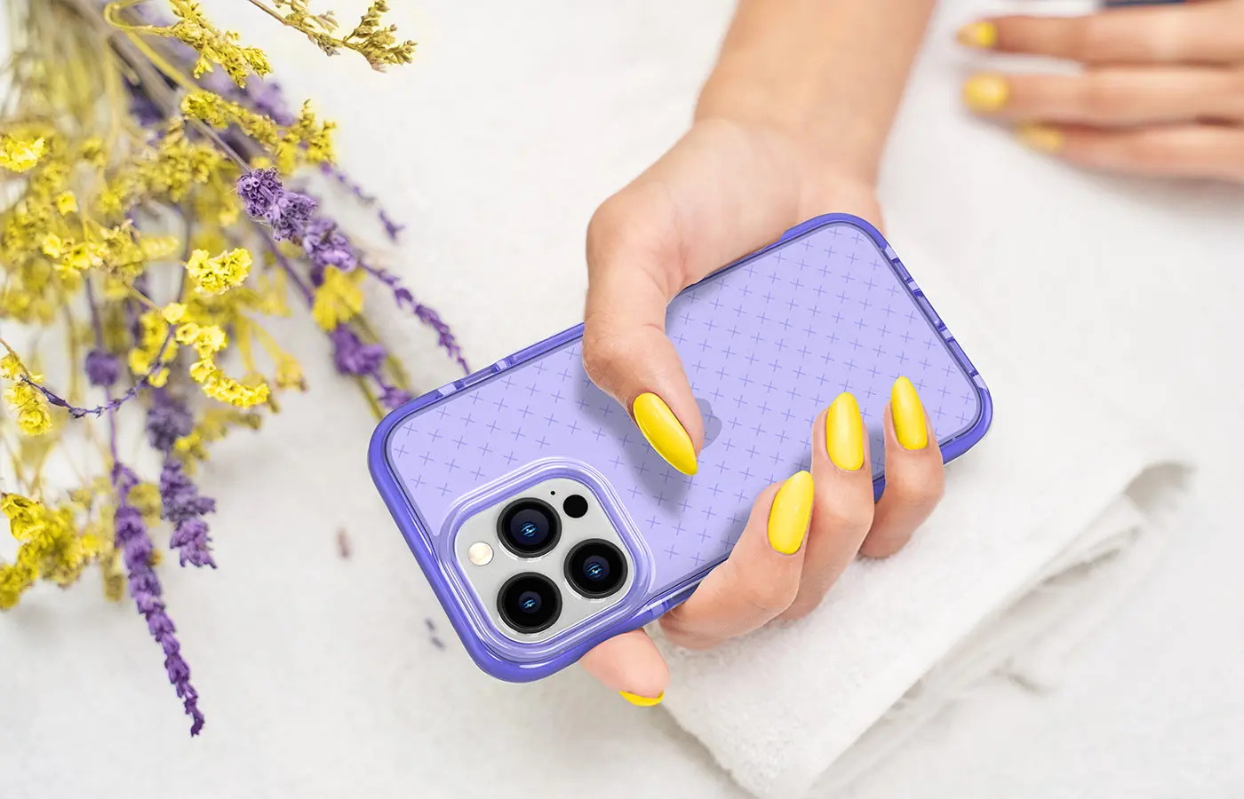 Hand holding lilac phone case